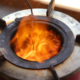 detail of burning mimi-moto cookstove