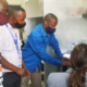 Sam Bentson trains Bernard Kabera and colleagues to use the new stove lab equipment