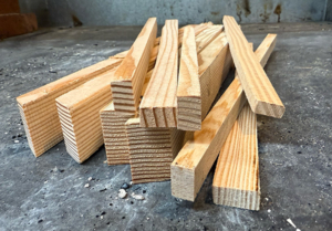 Varying sized sticks cut from douglas fir lumber.